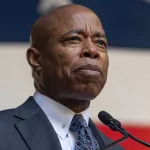 Eric Adams speaks during ceremony for final steel beam wrapped with American flag and signed by workers and officials raised at JP Morgan Chase new global headquarters in New York on November 20^ 2023