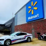 Police car parked in front of Walmart Store^ Fayetteville^ North Carolina^ USA^ August 6^ 2025