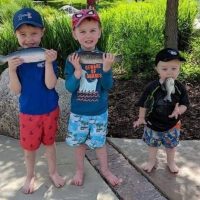 boys with fish in mouth