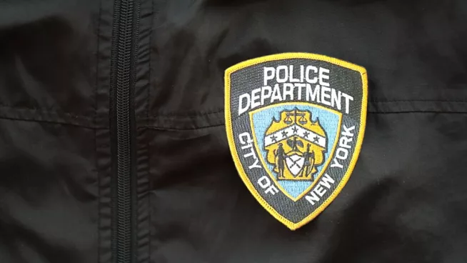 NYPD Police patch on black jacket uniform close up