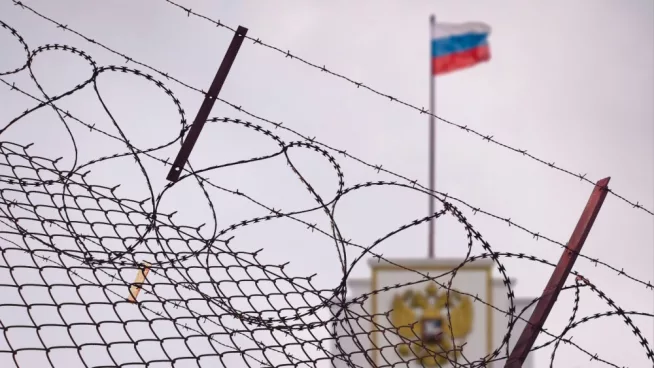 The concept of European and US sanctions pressure on the Russian Federation government. flag of the Russian Federation in barbed wire^ sanctions and aggression of Russia. Russian prison