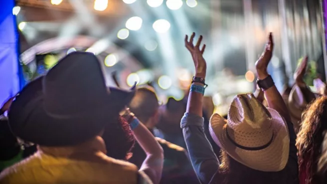 crowd enjoying live music at Huercasa Country Festival in Riaza^ Segovia^ Spain in 2017.