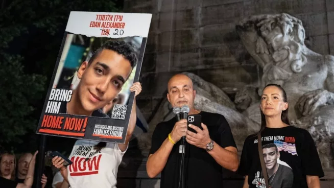 Adi Alexander speaks with Yael at his side^ parents of Edan Alexander at rally and memorial service for 6 hostages who were kidnapped and murdered by Hamas on Columbus Circle in New York on Sep 1 2024