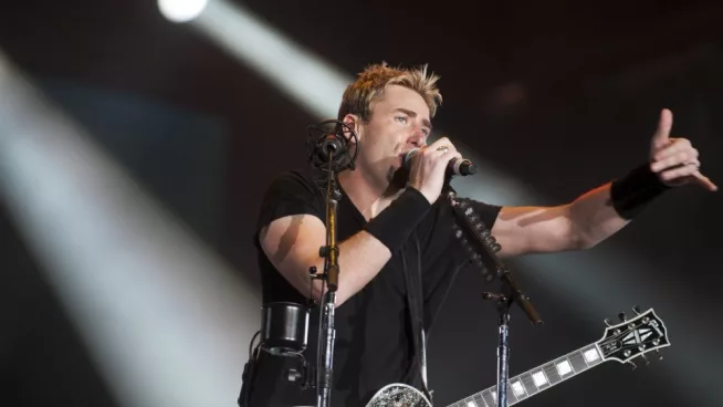 Chad Kroeger^ lead vocalist of the Canadian band Nickelback^ performs during the Rock in Rio 2013 concert^ on September 20^ 2013 in Rio de Janeiro^ Brazil.