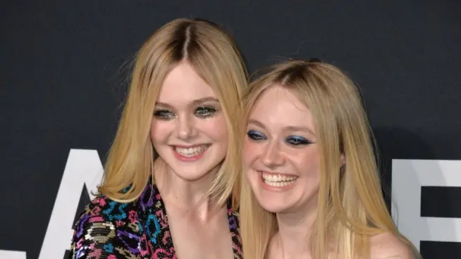 Elle Fanning & Dakota Fanning arriving at the Saint Laurent at the Palladium fashion show at the Hollywood Palladium. LOS ANGELES^ CA - FEBRUARY 10^ 2016