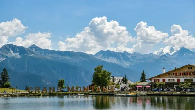 Big letters near lake spelling out Crans Montana in Switzerland during August 2020 Crans-Montana^ Switzerland - August 10^ 2020