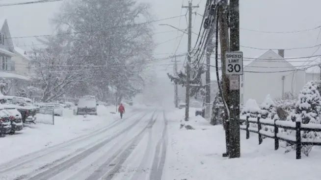 Person is walking in snow storm day on North Taylor Avein Norwalk NORWALK^ CT^ USA -FEBRUARY 7^ 2021