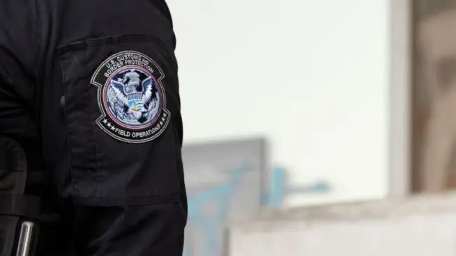 U.S. Customs and Border Protection (CBP) field officers guard a federal building during ICE deportation protests in Downtown LA. Los Angeles^ California^ USA - June 10^ 2025