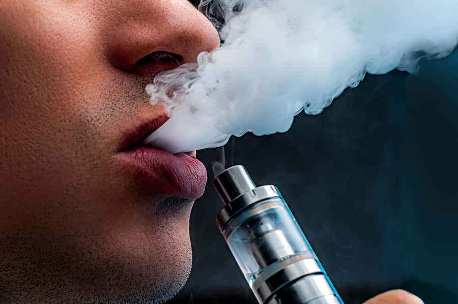close-up-young-man-vaping-e-cigarette-new-popular-vaping-devi