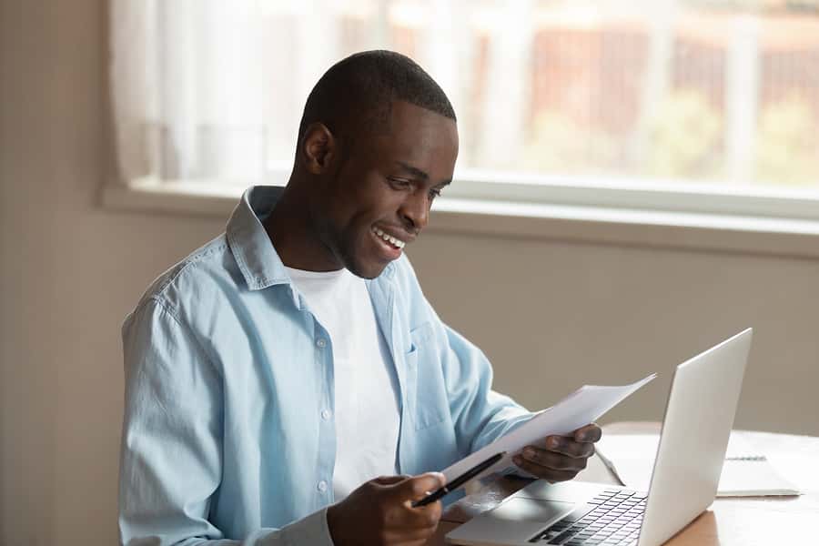 happy-young-african-american-man-received-last-loan-payment-bill