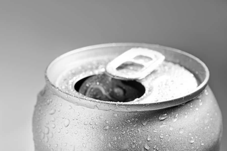 wet-open-can-on-grey-background-closeup