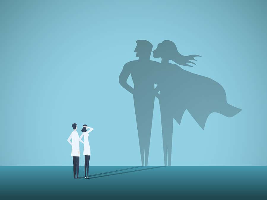 doctors-looking-at-superhero-shadow-on-the-wall-hospital-staff