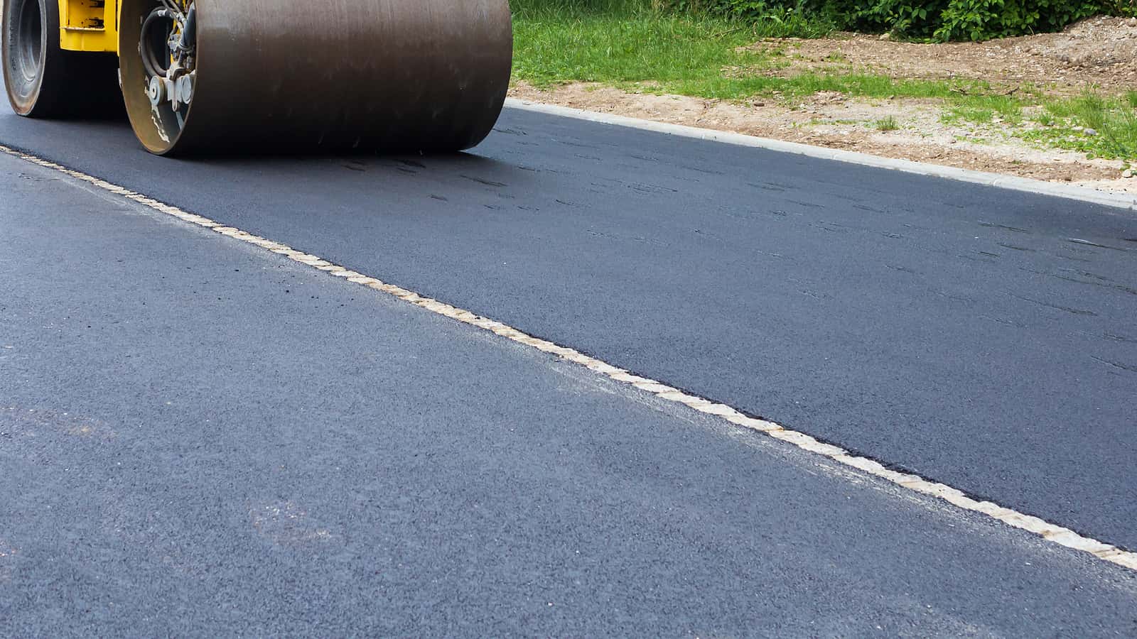 fresh-black-asphalt-on-new-street-road-construction-at-work
