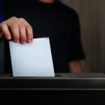 election-vote-hand-holding-ballot-paper-for-election-vote-conce