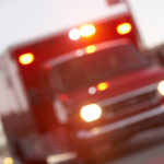 defocused-shot-of-ambulance-on-a-city-street