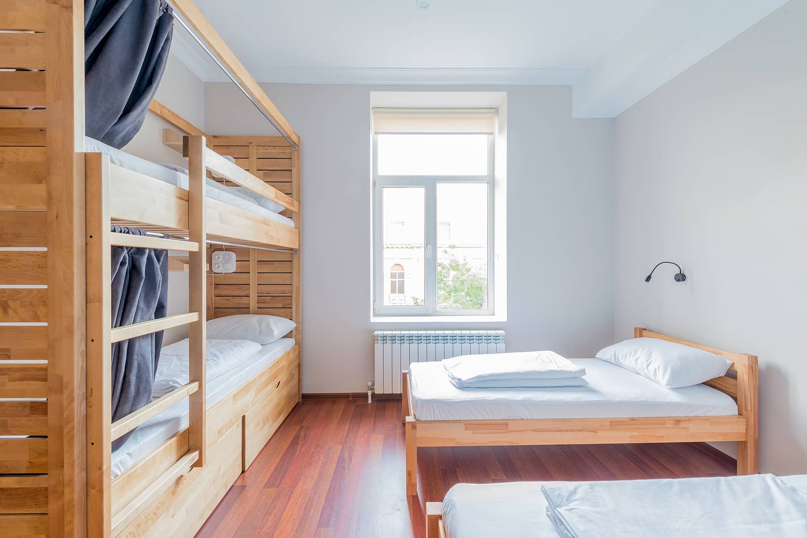 hostel-dormitory-beds-arranged-in-room