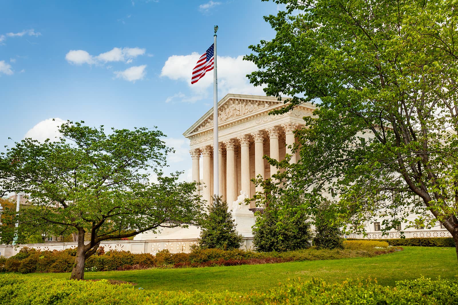 supreme-court-of-the-united-states-building-with-us-flag-over-sk
