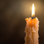 candle-flame-close-up-on-a-dark-background-melted-wax-candle-li