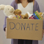 donation-box-with-children-toys-woman-collects-toys-for-charity