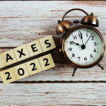 taxes-2022-alphabet-letter-with-space-copy-on-wooden-background