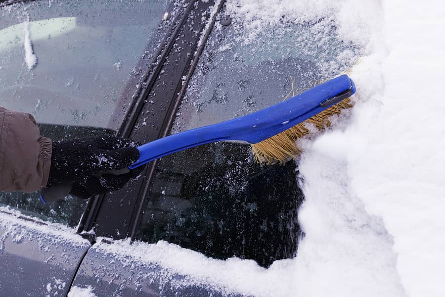 cleaning-the-car-from-snow-in-winter-snow-covered-car-after-a-s