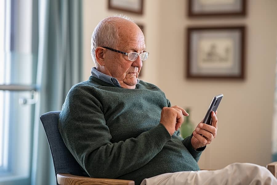 old-man-wearing-eyeglasses-to-use-smartphone-at-home-handsome-s