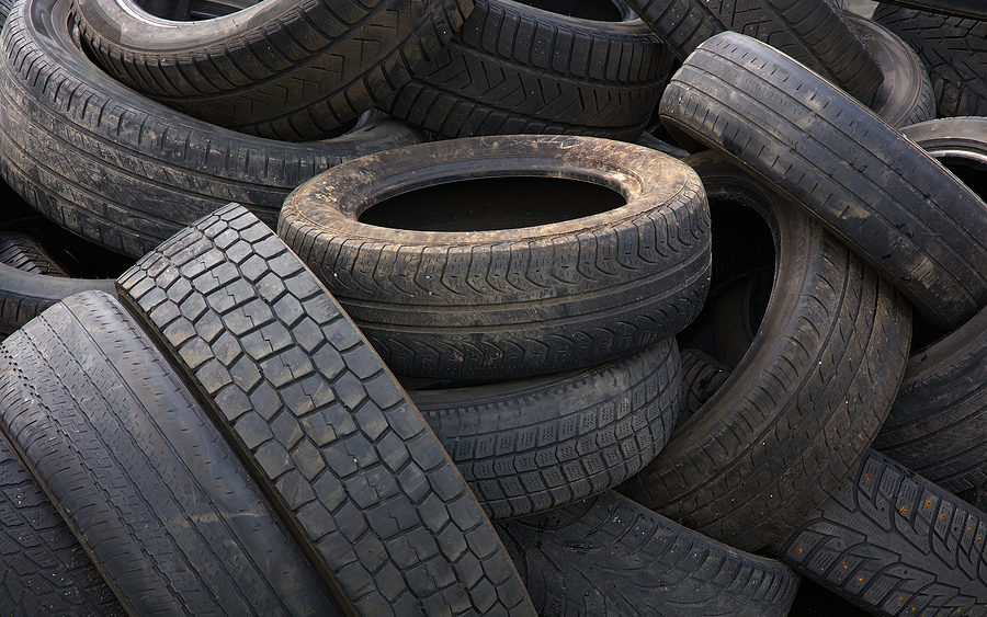 rubber-tire-recycling-pile-of-scrap-wheels-automobile-garage-was