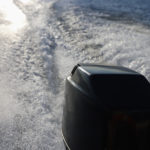 rear-view-of-speed-boat-or-motor-boat-running-high-speed-on-sea