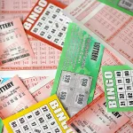 many-used-lottery-tickets-bills-with-numbers-and-bingo-playing