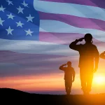 silhouettes-of-soldiers-saluting-on-background-of-usa-flag-gree