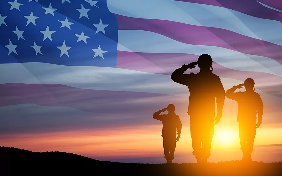 silhouettes-of-soldiers-saluting-on-background-of-usa-flag-gree