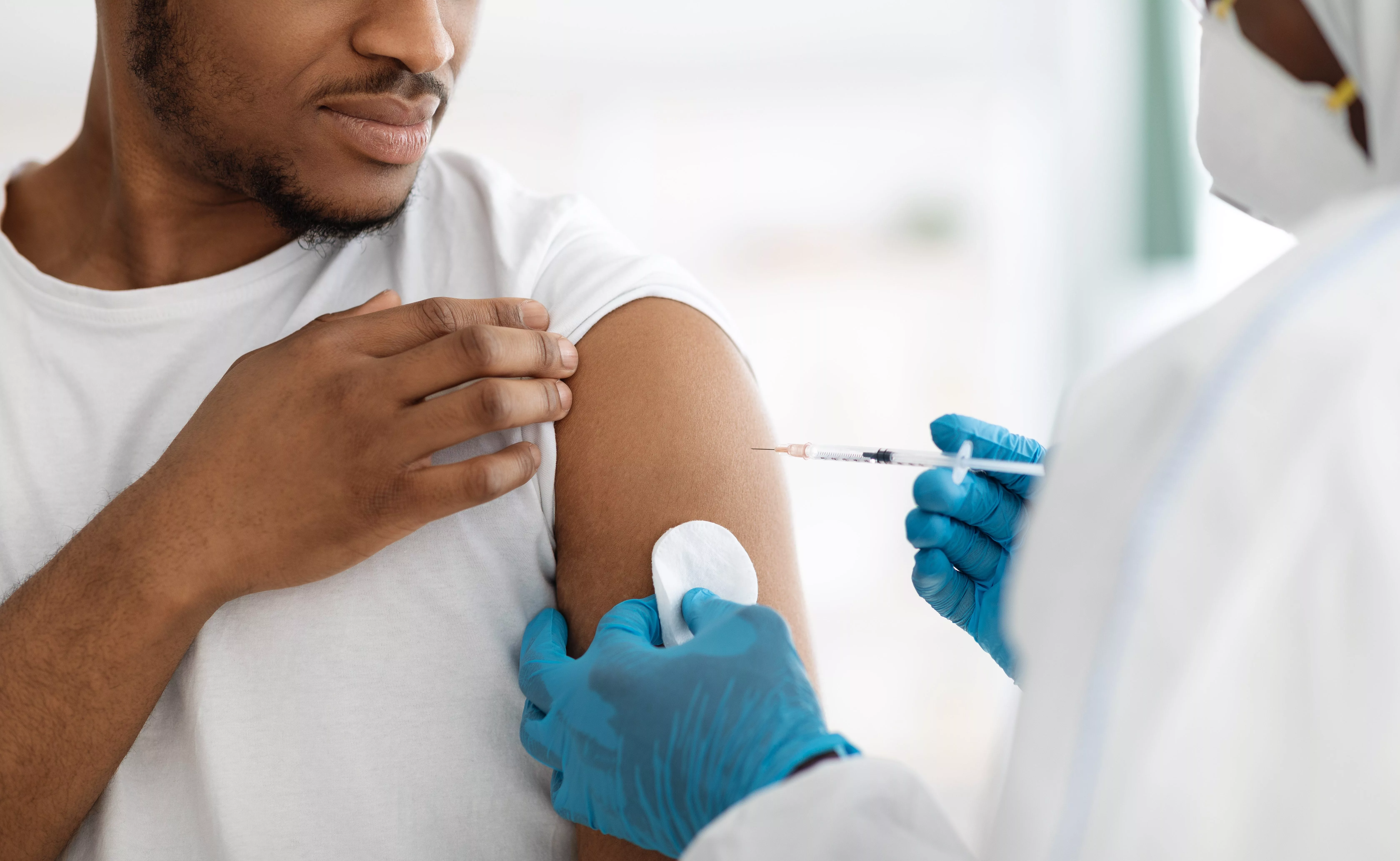 cropped-of-black-man-receiving-vaccine-shot