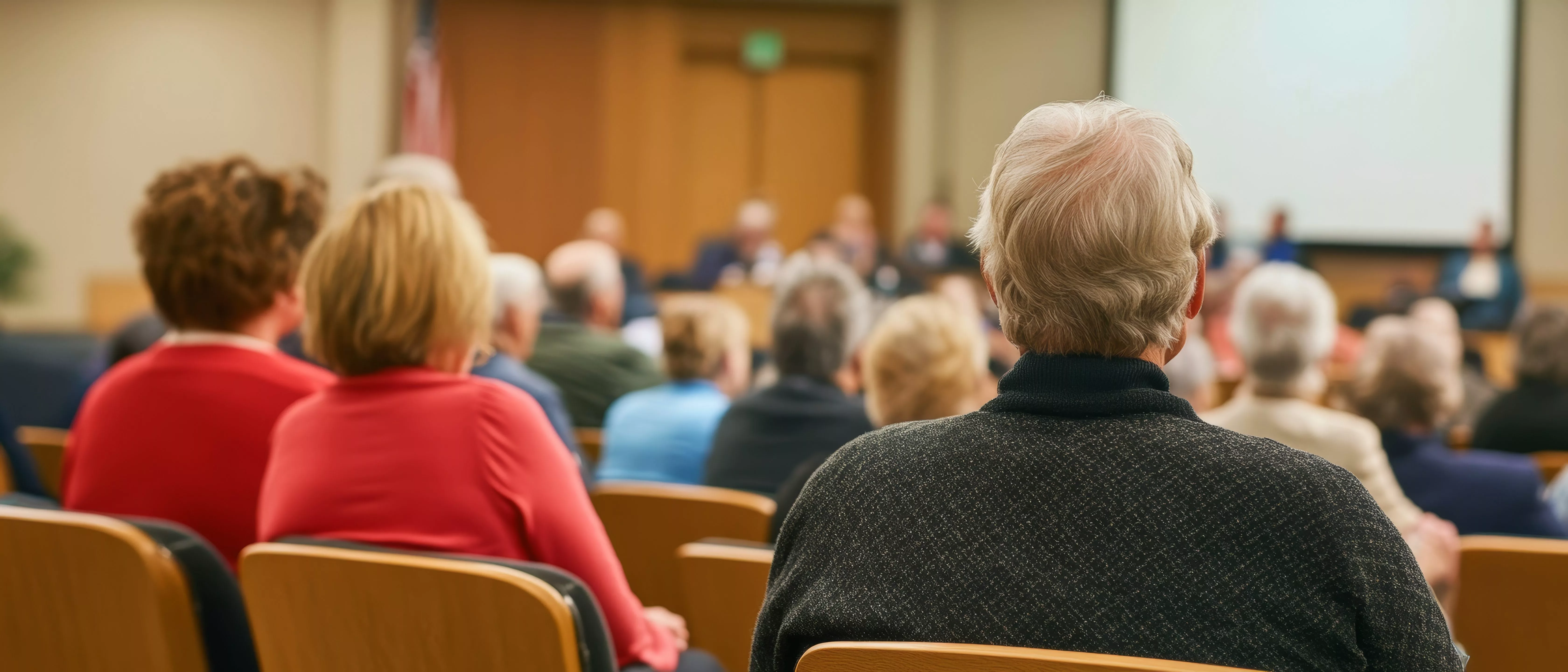 a-town-hall-meeting-about-retirement-savings-and-social-security-with-seniors-in-attendance-emphasizing-public-policy-impacts