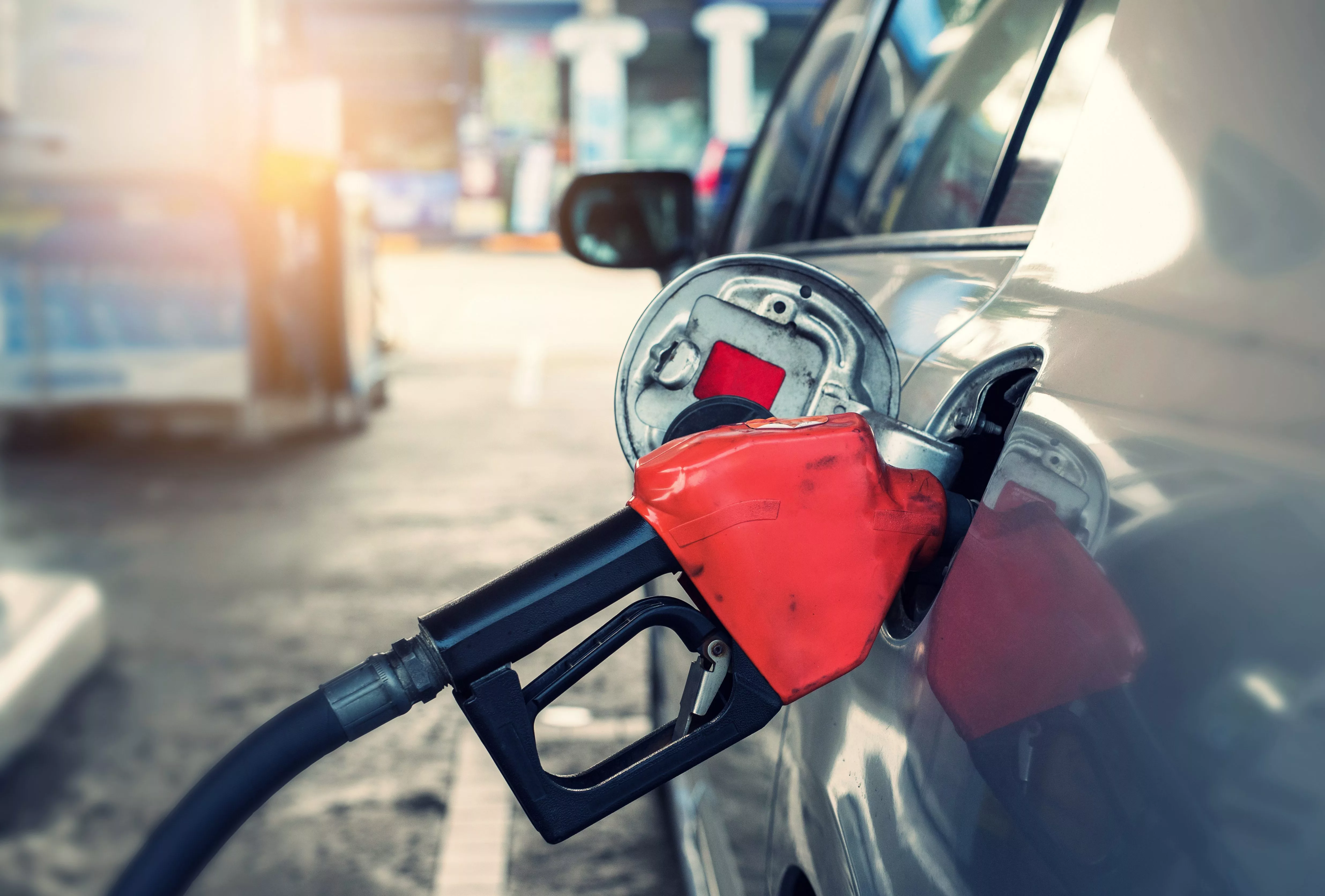 pumping-gasoline-fuel-in-car-at-gas-station