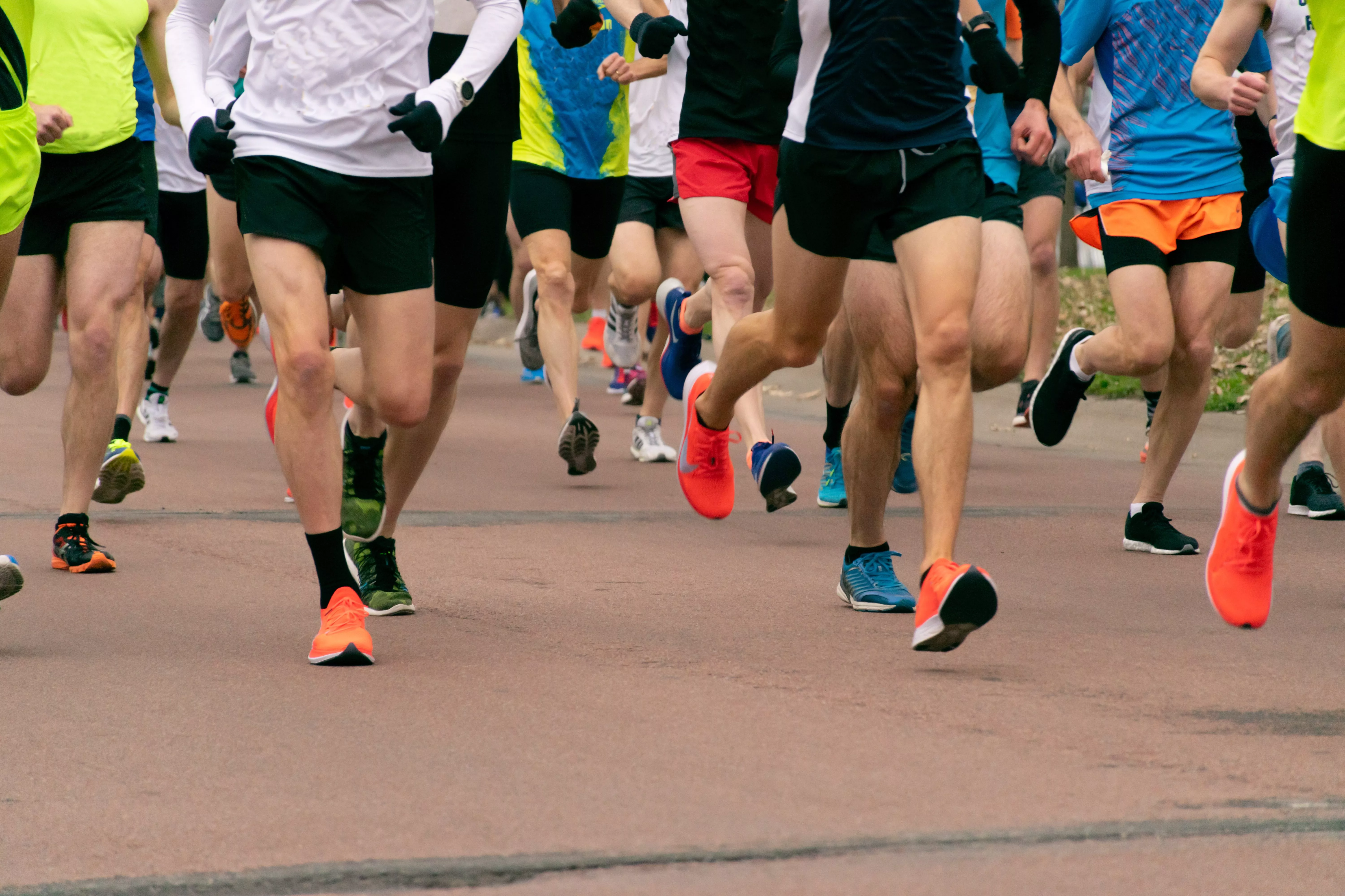 young-men-running-on-asphalt-road