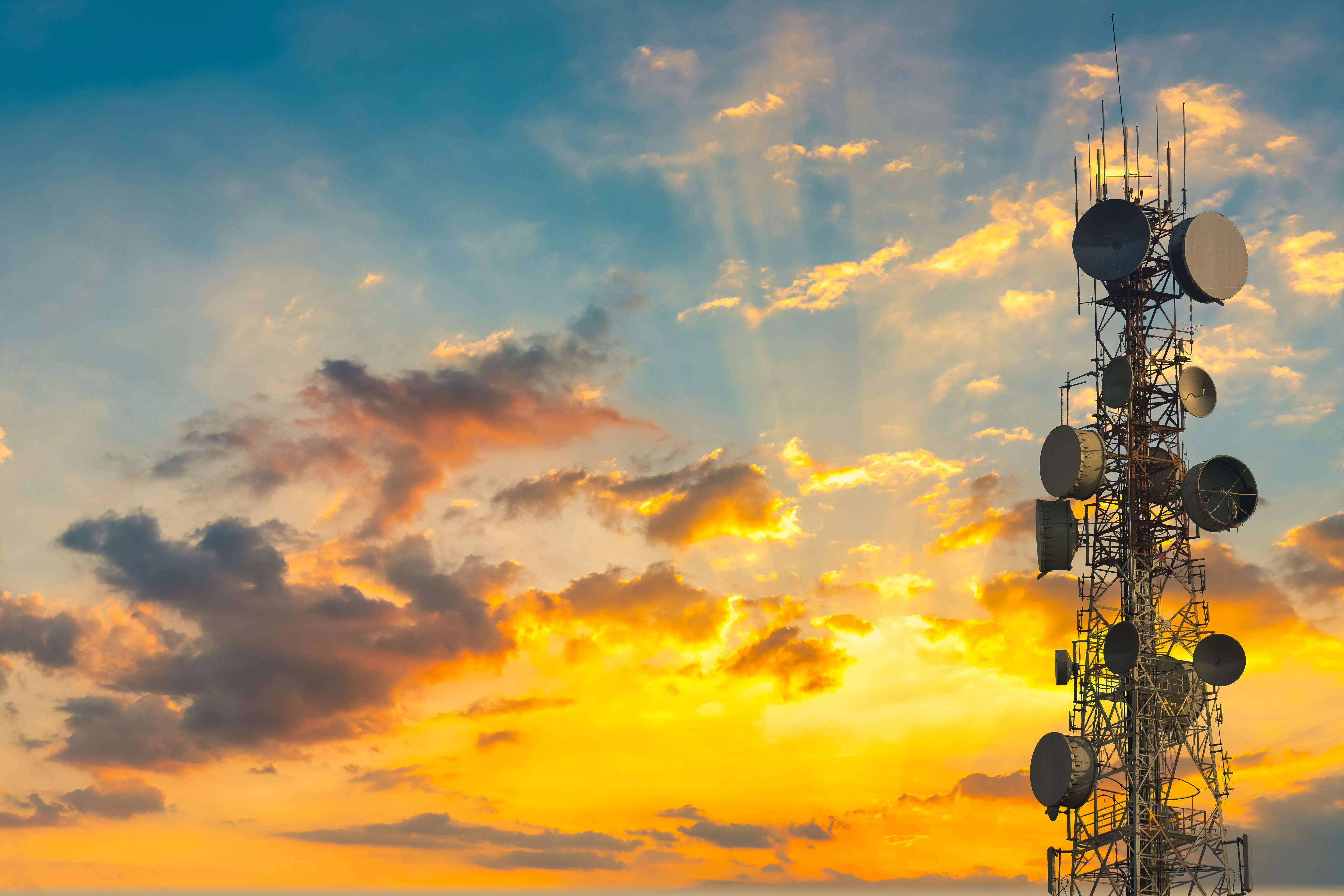 telecommunication-tower-at-sunset-sky-background