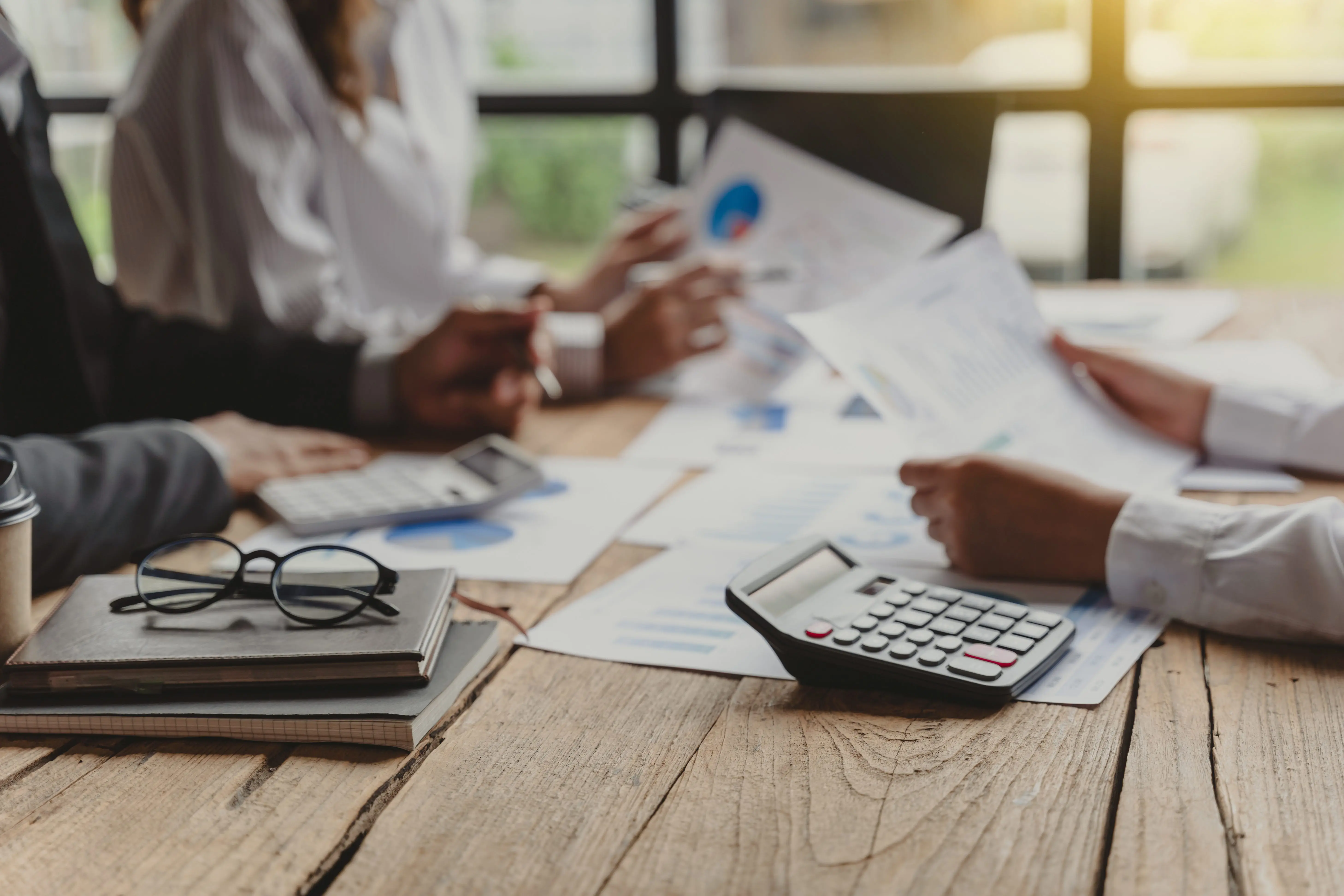 three-business-people-meeting-and-consulting-financial-and-tax-at-office-desk