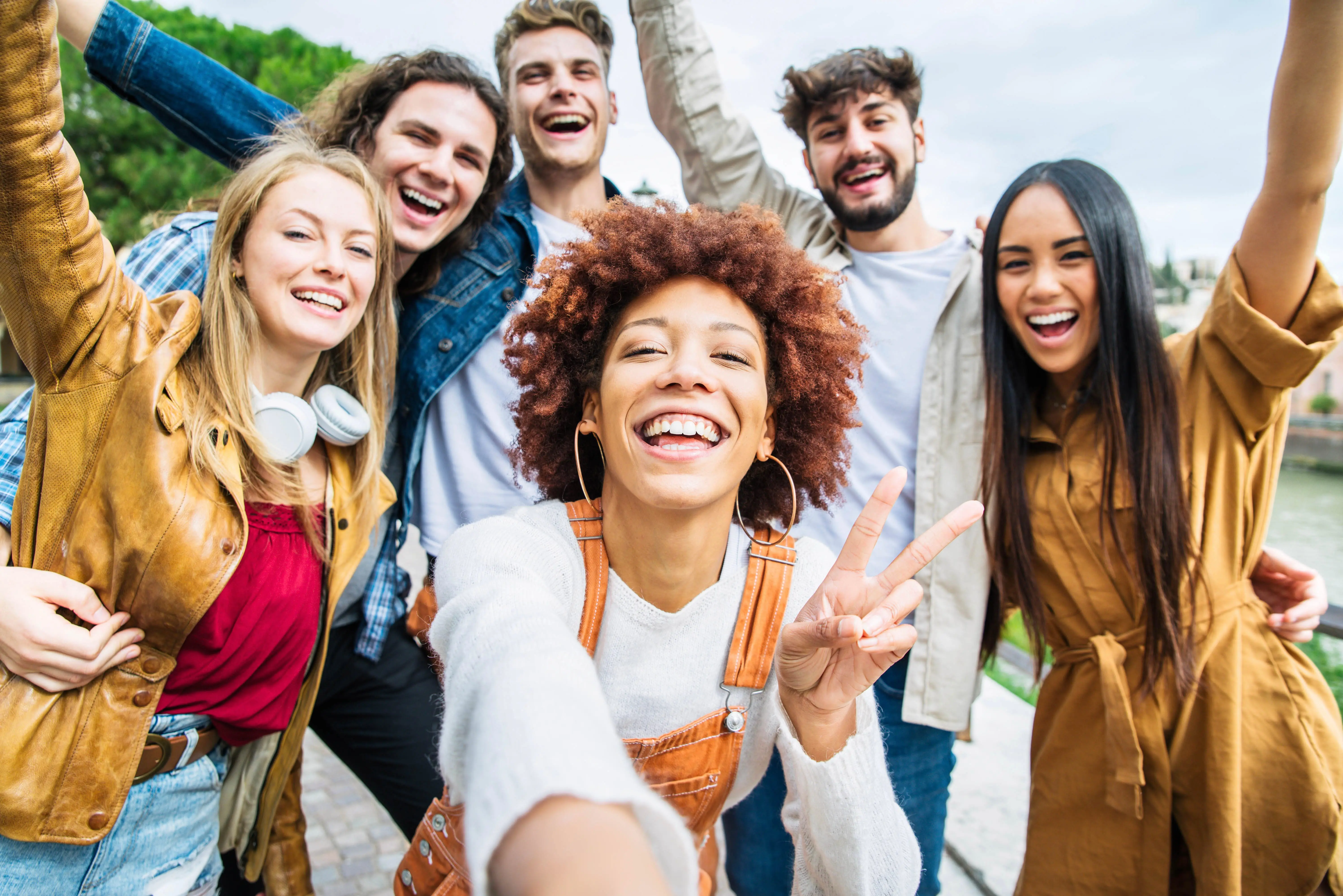 multiracial-group-of-friends-taking-selfie-pic-outside-happy-d