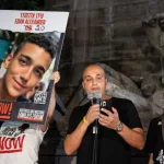 Adi Alexander speaks with Yael at his side^ parents of Edan Alexander at rally and memorial service for 6 hostages who were kidnapped and murdered by Hamas on Columbus Circle in New York on Sep 1 2024
