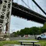 NYPD Police truck responding to a person who has climbed up the George Washington Bridge in Fort Washington Park New York^ NY USA - May 18^ 2024