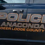 Sign on Anaconda Deer Lodge County police car in closeup. Anaconda^ MT^ USA - May 6^ 2025