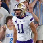 Washington's Jalen McMillan (11) celebrates with teammates after scoring a touchdown against the UCLA during an NCAA college football game Friday^ Sept. 30^ 2022^ in Pasadena^ Calif.