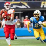KC Chiefs tie end Travis Kelce #87 catches a pass next to LA Chargers safety AJ Finley #24 during an NFL football game at SoFi Stadium^ Aug. 17^ 2024^ in Inglewood^ Calif.