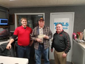 Mark McDonald (center) is presented with his $1,000 check from RVR's Nate Gonner (left) and John McGee (right)