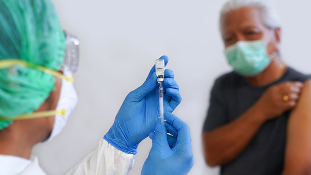 a-doctor-is-about-to-give-a-shot-to-a-patient