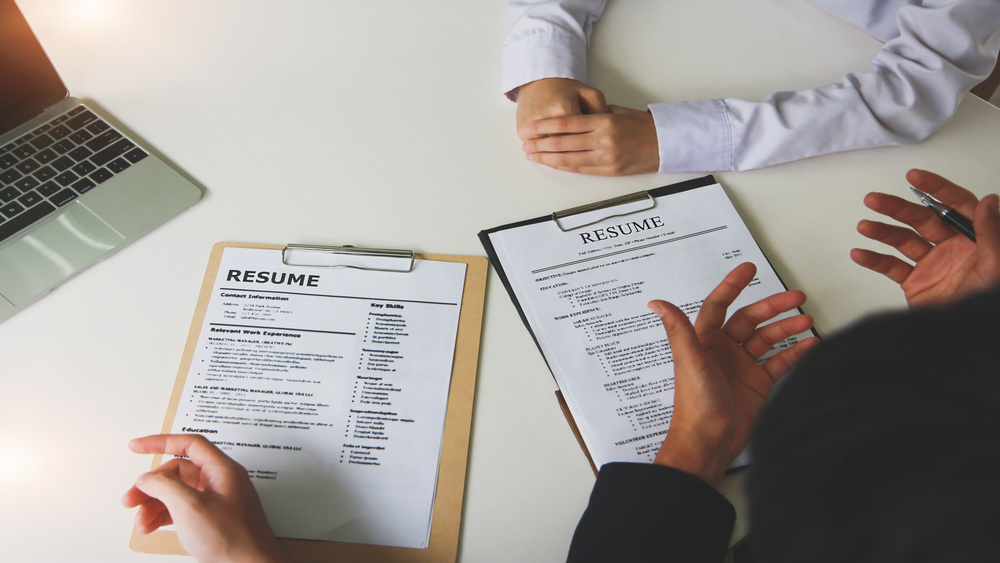 office-job-interviews-with-hr-personnel-holding-resume-and-background-checks-on-applicants-with-prepared-skills