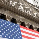 Grand American flag displayed on the facade of the New York Stock Exchange in downtown Manhattan. New York^ NY^ USA - 11.05.2024
