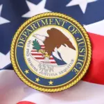US Department of Justice seal on United States of America flag close up