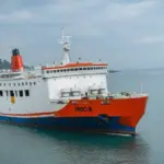 Merak^ 22 February 2026 Passenger ferry crossing the Sunda Strait connecting Java and Sumatra^ featuring large roll-on roll-off vessels operating between Merak and Bakauheni under a cloudy sky.