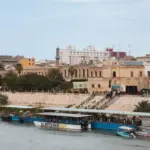 Historic buildings and riverboats on the Tigris River in Baghdad^ Iraq Baghdad^ Iraq - March 22^ 2025